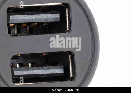 horizontal view in foreground of a car lighter charger with two usb connectors Stock Photo