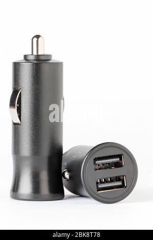 horizontal view of two black color car lighter chargers with  usb socket isolated on white background Stock Photo