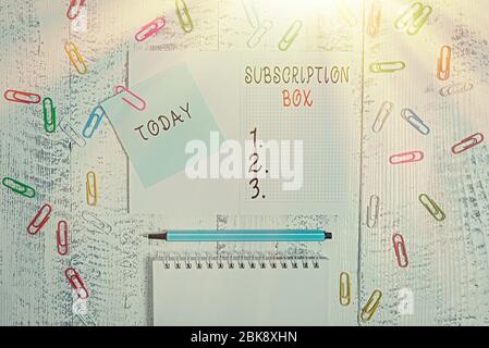 Handwriting text writing Subscription Box. Conceptual photo button if you clicked on will get news or videos about site Squared spiral notepad clips n Stock Photo