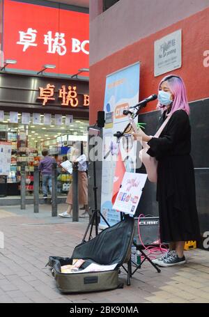 Sailor Candy NG performing on the streets of Mongkok, Hong Kong Stock ...