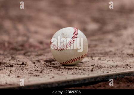 Baseball on a dirt baseball field Stock Photo
