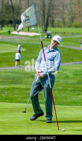 Trumbauersville, United States. 02nd May, 2020. Slava Korotitski of Doylestown reacts after missing the 9th hole while playing a round of golf on a beautiful spring day Saturday, May 02, 2020 at Fox Hollow Golf Course in Trumbauersville, Pennsylvania. It was the second day of golf courses being open after a 6 week stay at home order was lifted for some businesses. Credit: William Thomas Cain/Alamy Live News Stock Photo