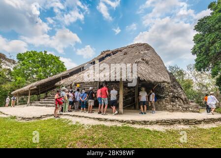 Kohunlich, Mexico - April 25, 2019: Tourists group visiting old ruin at the Mayan city of Kohunlich - large archaeological site of the pre-Columbian M Stock Photo