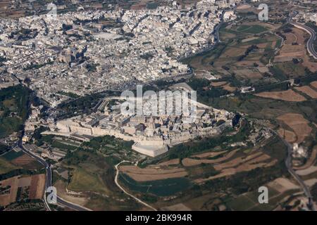 The historic walled city of Mdina and neighbouring town Rabat in Malta, as seen from the air. Travel in Europe. Aerial view. Stock Photo