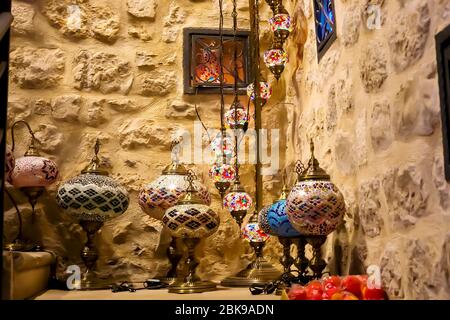 Gift shop with a variety of Turkish lamps for sale. The background is blurred, out of focus. Kotor, Montenegro Stock Photo