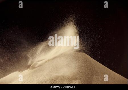 Sand flying throwing freeze stop motion. Stock Photo