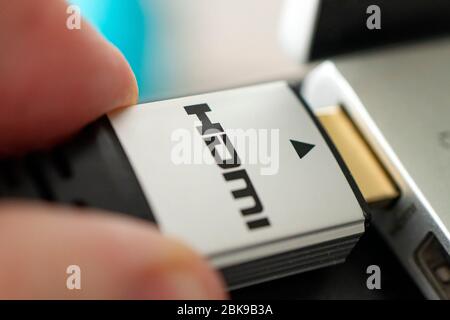 hdmi high definition multimedia interface on hand. High-speed 8K signal transmission. HDMI connector Stock Photo