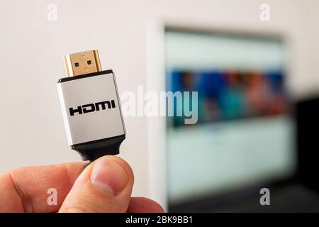 HDMI line connecting the audio and video system of notebook to projectoror TV. 4K high-speed signal transmission. High quality signal cable for profes Stock Photo