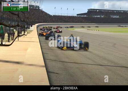 In this image taken from video provided by iRacing IndyCar, driver Scott McLaughlin, front, leads the field during the first lap of the First Responder 175 presented by GMR virtual IndyCar auto race at the Indianapolis Motor Speedway, Saturday, May 2, 2020, in Indianapolis, Ind. (iRacing IndyCar via AP) Stock Photo