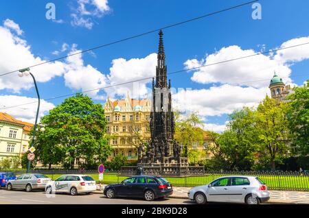 Prague, Czech Republic, May 13, 2019: Kranner Fountain neo-gothic monument to Emperor Francis I of Austria in Park of National Awakening in Old Town historical center, blue sky white clouds, Bohemia Stock Photo