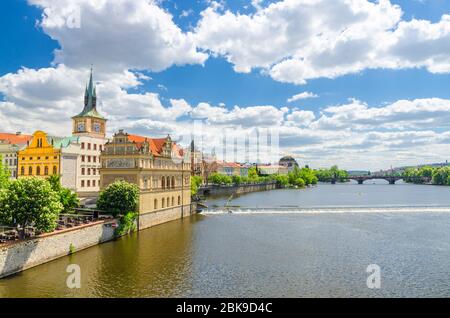 Prague, Czech Republic, May 13, 2019: Bedrich Smetana Museum on the bank of Vltava river in old town historical city center, view from Charles Bridge Karluv Most, blue sky white clouds, Bohemia Stock Photo