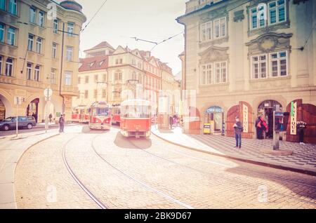 Prague, Czech Republic, May 13, 2019: Typical old retro vintage tram on tracks near tram stop in the streets of Prague city in Lesser Town Mala Strana district, Bohemia, Public transport concept. Stock Photo