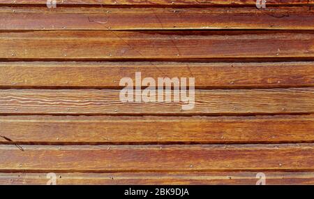 The old wood texture, weathered, reclaimed bright orange wood backdrop. Stock Photo