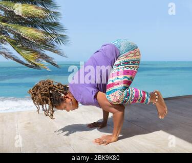 Beautiful woman doing yoga on the beach, extreme details, strong depth of  field, bright colours | Wallpapers.ai