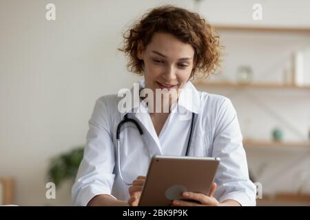 Young female professional doctor using digital tablet in hospital Stock Photo