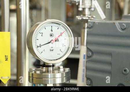 Gates, taps, monometers at the pharmaceutical plant. Open the supply of ...