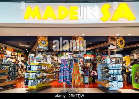 shoppers, people browsing in an airport store, shop for gifts, curios, mementos, souvenirs at Cape Town International airport, South Africa Stock Photo
