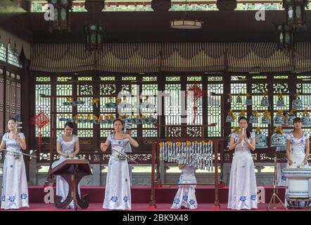 Jingdezhen, Jiangxi province / China - May 29, 2014: Female music ensemble performing traditional Chinese music on porcelain instruments in Jingdezhen Stock Photo