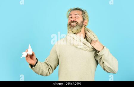 happy hipster presenting best remedy. Nasal drops plastic bottle. pandemic concept. man treat runny nose with nasal spray. free your stuffy nose. no addiction to medicals. coronavirus from china. Stock Photo