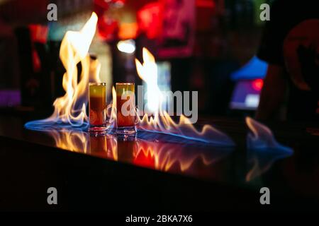 burning cocktails on the bar Stock Photo