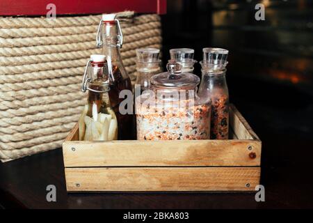 condiments in cans in a box Stock Photo