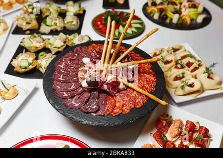 different types of sausage on a stone tray Stock Photo