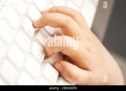 Kid Computer Hand hand child playing computer on top view isolated on white background ...