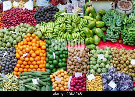 A variety of fruit and vegetables in an open air market market on the island of Madeira Stock Photo