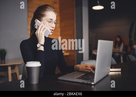 Woman works remotely online from home while quarantine coronavirus is in effect. Concept of checking mail, blogger Stock Photo