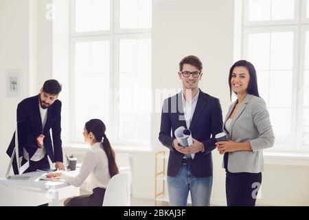 Business people busy discussing analyze project risks at workplace in modern white office. Stock Photo
