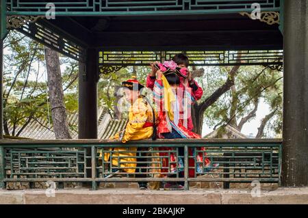 Chengde / China - October 3, 2014: Children wearing traditional Chinese imperial clothes, Imperial Summer Villa at Chengde Mountain Resort, Chengde, H Stock Photo