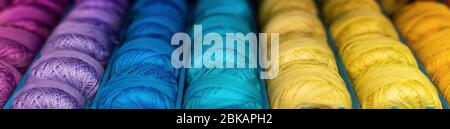 skeins of colored woolen threads background. Stock Photo