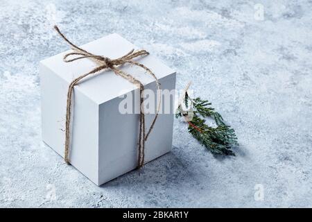 white gift box on grey painted background Stock Photo