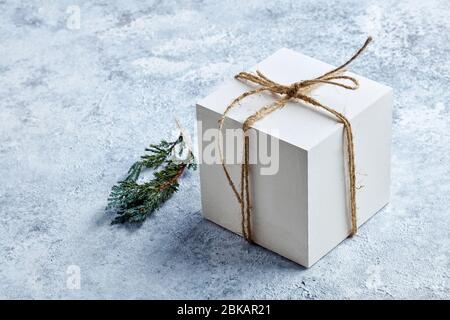 white gift box on grey painted background Stock Photo