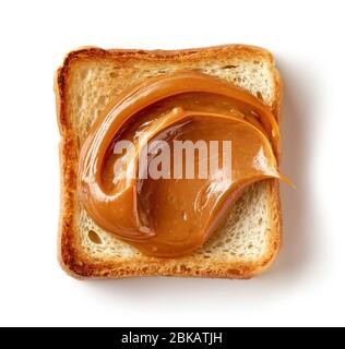 toasted bread slice with melted caramel isolated on white background, top view Stock Photo