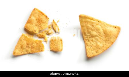 whole and broken corn chips nachos isolated on white background, top view Stock Photo