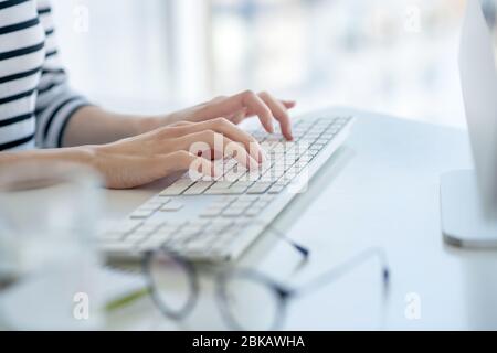Close up picture of female hands typing Stock Photo
