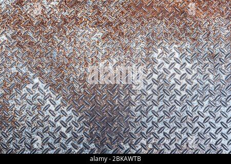 Old and rusted Metal diamond plate pattern texture, background Stock Photo