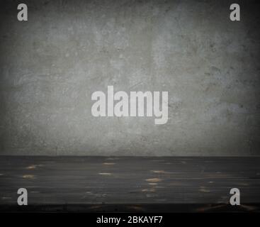Old dark wood kitchen table top and grey wall background Stock Photo