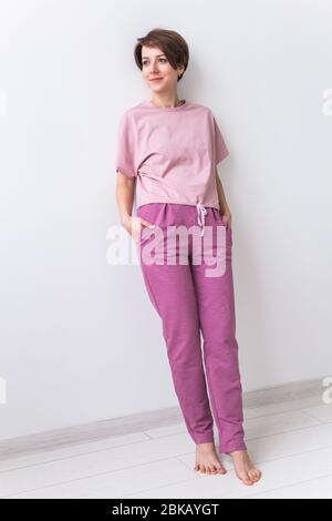 Warm pink kit for homewear. Soft cotton t-shirt and pants. Comfortable  clothes for healthy sleep. Pajamas concept Stock Photo - Alamy