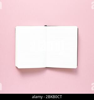 Empty notebook on pink background. top view, copy space Stock Photo