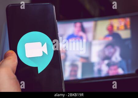 hand use videoconference app icon Goole Meet meeting  Stock Photo