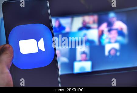 hand use videoconference app icon of Zoom Meeting. Stock Photo