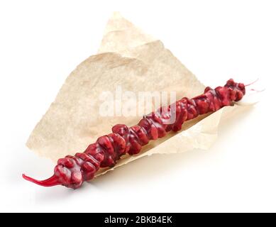 Traditional Georgian homemade sweets with walnuts and grape juice  Churchkhela isolated on white background Stock Photo