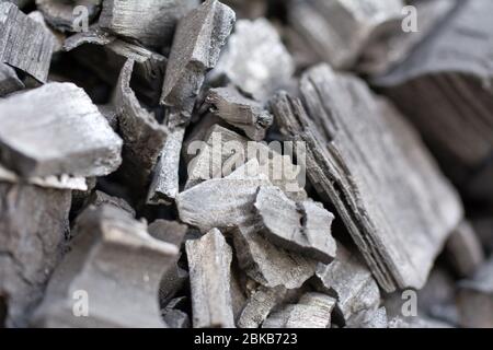 Natural black charcoal texture background. Hard wood charcoal for barbecue at picnic. Selective focus Stock Photo