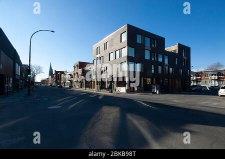 MONTREAL, CANADA - APRIL 28, 2020: During Covid19 lock-down, Rue Saint Hubert clearly shows the impact of the pandemic on the traffic on one of the mo Stock Photo