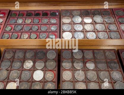 Well organized coin collection on display Stock Photo