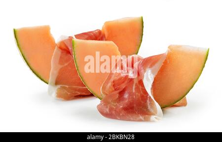 melon slices and prosciutto ham isolated on white background Stock Photo