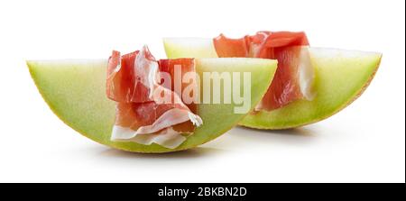 Melon slices with prosciutto ham isolated on white background Stock Photo