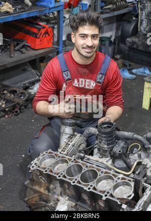 Mechanic repairing  car engine in Tehran, Iran, Persia, Middle East Stock Photo